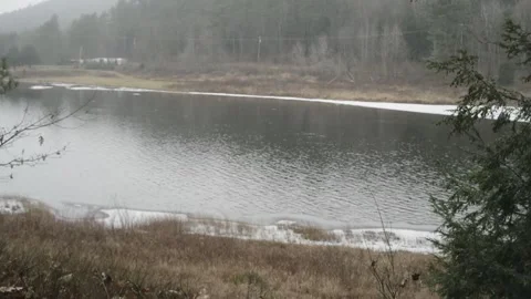 Peaceful setting of rippling river waters 스톡 동영상 166004179