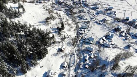 Peaceful small town under deep, fresh snow,   Winter, aerial view. Stock Footage 124424337