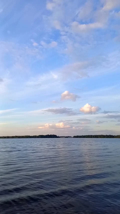 Peaceful Spring Evening Over a River with Soft Clouds, Vertical Nature Footage Stock Footage 342449257