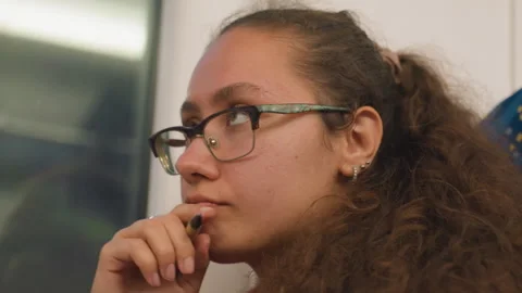 Peaceful student calmly examining notes during train journey. Tranquil Stock Footage 330166134