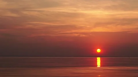 A peaceful sunset over the calm sea Stock Footage 313194673