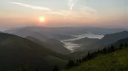 Peaceful Sunset Over Green Alpine Mountains Nature With Mist Clouds Time Lapse Stock Footage