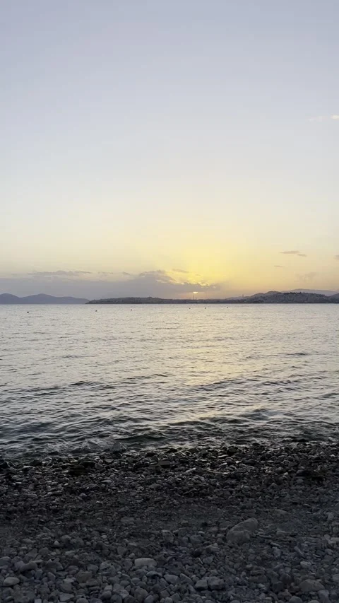 Peaceful Sunset Seascape with Unrecognizable Man on Shore Stock Footage 336965066