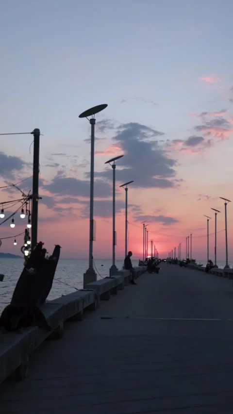 Peaceful Sunset View Along a Long Pier by the Sea Stock Footage 344038023