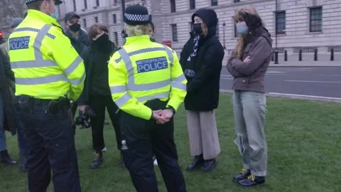 PEACEFUL TALKS BETWEEN PROTESTERS AND POLICE AT SARAH EVERARD PROTEST Stock Footage 150383393