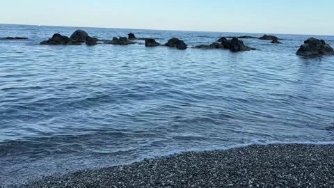 Peaceful time-lapse of a calm seaside with gentle waves lapping the shore Stock Footage 308883043