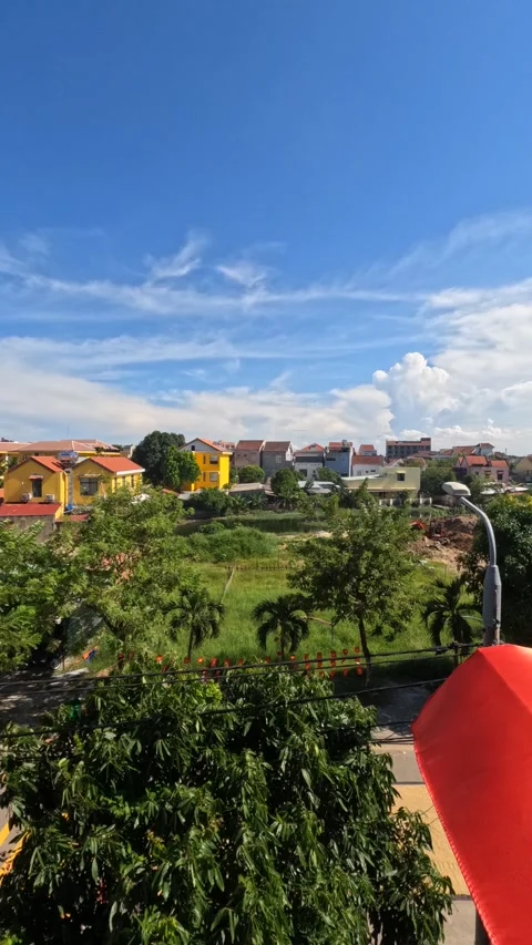 A peaceful time-lapse of white clouds drifting across the rural countryside of H Stock Footage 320243114
