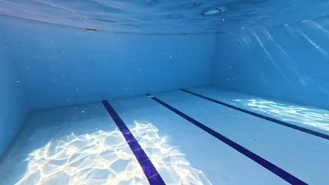 Peaceful Underwater View of Sunlight and Moving Water Reflections 動画素材 340899118
