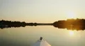 Peaceful view of beautiful sunset on river, riding a boat HD Footage