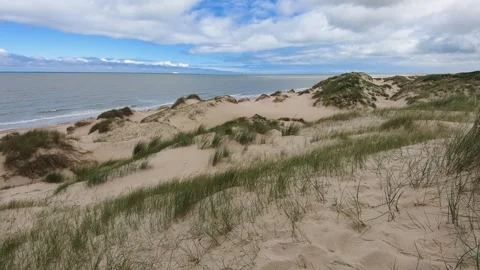 Peaceful view of rolling sand dunes along the English Channel coastline 스톡 동영상 283864646