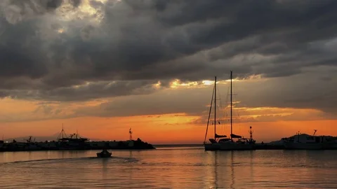 Peaceful view on small harbour with many parked boats at sunset in Greece Stock Footage 80484515