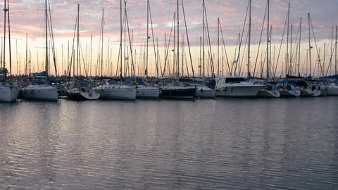 Peaceful view on small harbour with many parked sailing boats at early morning b 動画素材 99115163