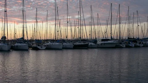 Peaceful view on small harbour with many parked sailing boats at early morning b Video stock 99115245