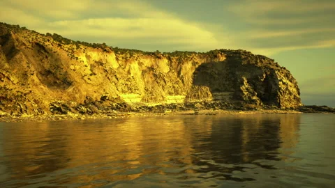 Peaceful water surface captures warm hues and soft wave patterns Stock Footage 340340647