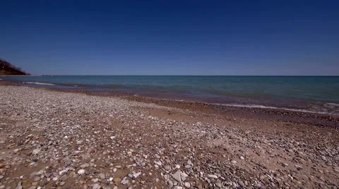 Peaceful Waves on Rocky Beach 2 - slow pan left to right Stock Footage 4853873