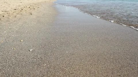 Peaceful waves touching the shore Stock Footage 12271483
