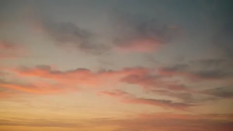 Peaceful Wide Angle Sunset Sky with Soft Pink Clouds and Golden Light Stock Footage 340318151