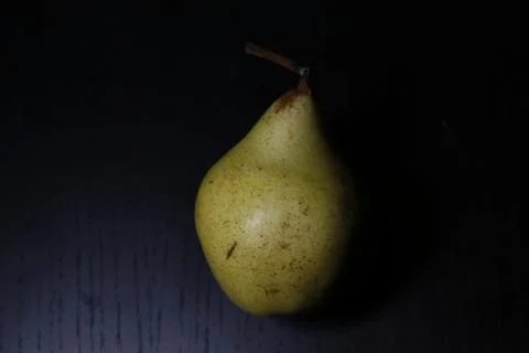 A peach in black background Stock Photos