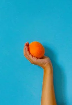 Peach on blue wall Stock Photos