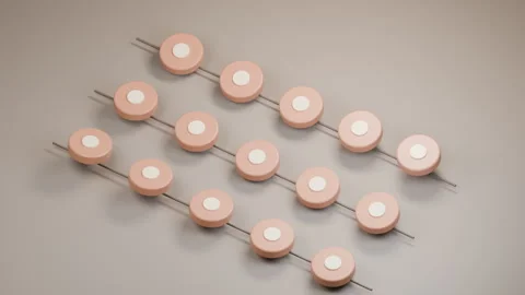 Peach Ceramic Discs Floating Along Three Parallel Tracks 库存影片 347887386