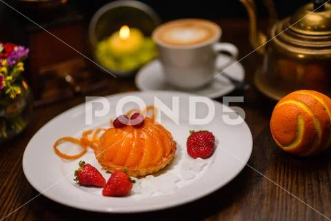 Peach dessert decorated with strawberries Stock Photos