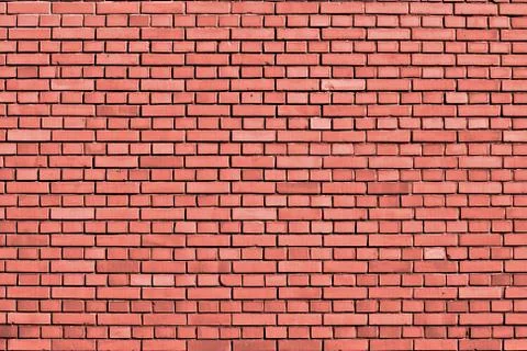 Peach echo colored brick wall background Stock Photos