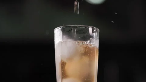 Peach Extract Juice Flowing Through Ice Cubes With Dynamic Splash Close Up Stock Footage 344050715