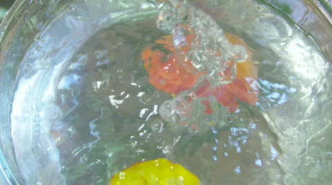 Peach falling into the water 120fps Video stock 559154
