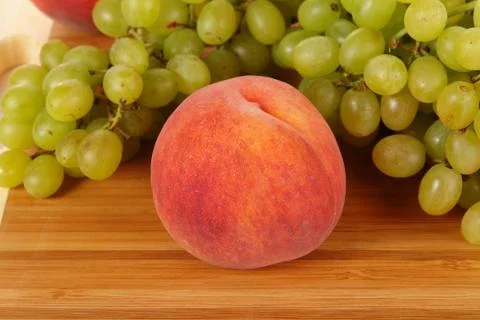 Peach with grape Stock Photos