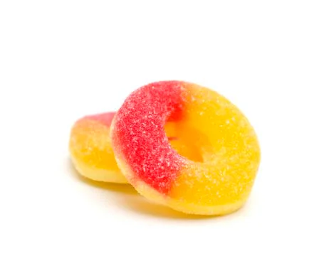 Peach Gummies on a White Background Stock Photos