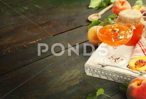 Peach jam with fresh peaches on table Stock Photos