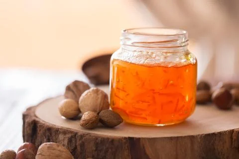 Peach jam in a transparent jar. Copy space for text 写真素材