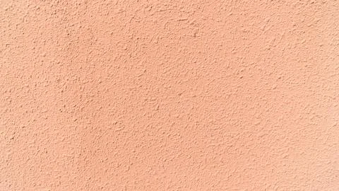Peach Plaster Wall Background with Even Texture and Copy Space Fotos Stock