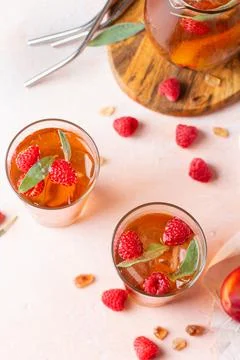 Peach raspberry iced tea, summer refreshing drink, beverage, cocktail Stock Photos