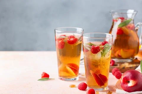 Peach raspberry iced tea, summer refreshing drink, beverage, cocktail Stock Photos