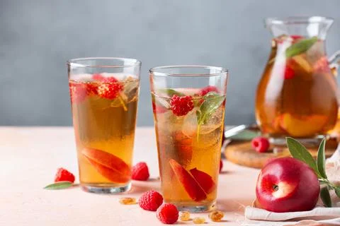 Peach raspberry iced tea, summer refreshing drink, beverage, cocktail Stock Photos
