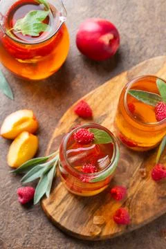 Peach raspberry iced tea, summer refreshing drink, beverage, cocktail Stock Photos