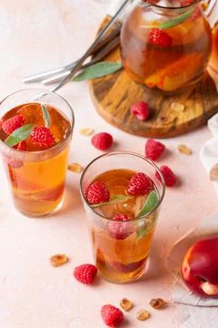 Peach raspberry iced tea, summer refreshing drink, beverage, cocktail Stock Photos