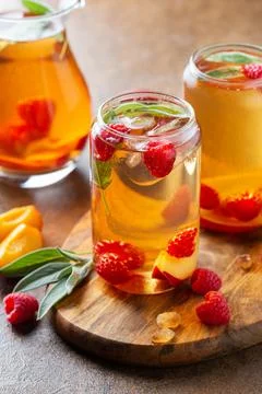 Peach raspberry iced tea, summer refreshing drink, beverage, cocktail Stock Photos