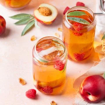 Peach raspberry iced tea, summer refreshing drink, beverage, cocktail Stock Photos