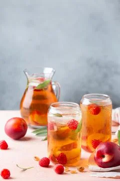 Peach raspberry iced tea, summer refreshing drink, beverage, cocktail Stock Photos