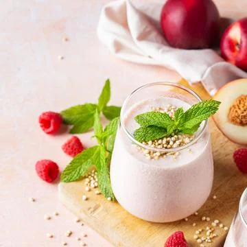 Peach raspberry smoothie, summer refreshing drink, beverage Stock Photos