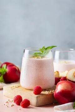 Peach raspberry smoothie, summer refreshing drink, beverage Stock Photos