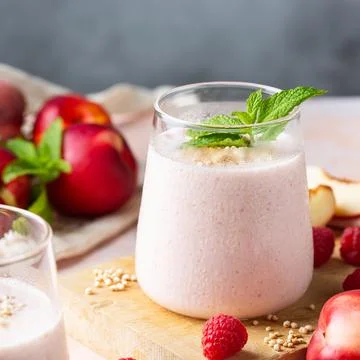 Peach raspberry smoothie, summer refreshing drink, beverage Stock Photos
