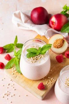 Peach raspberry smoothie, summer refreshing drink, beverage Stock Photos