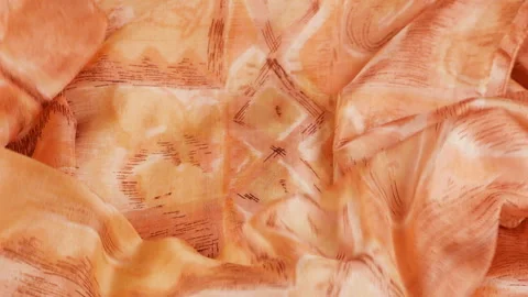 Peach silk scarf falling on white background in slow motion. Stock Footage 337404703