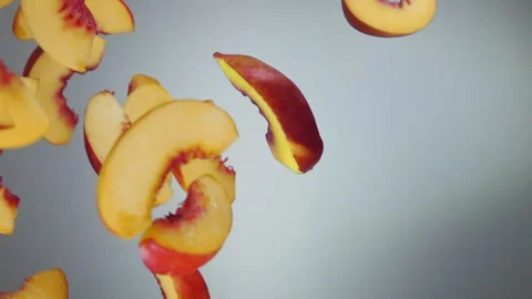 Peach slices fly down on a white background Video stock 120576666