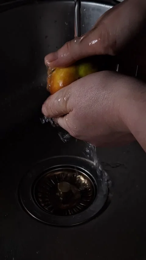 Peach under a tap with water Stock-Footage 342662668