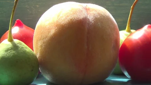 Peach, wild pears, red tomatoes on the windowsill, vegetables, fruits. 動画素材 282300769