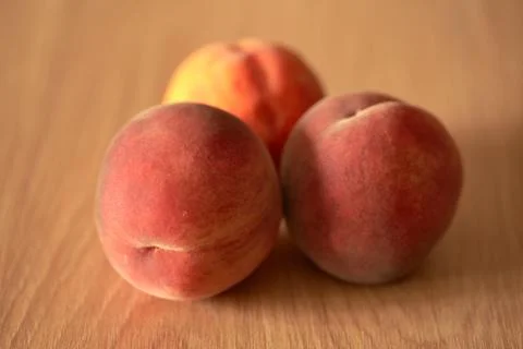 Peaches are on the table in the kitchen Stock Photos